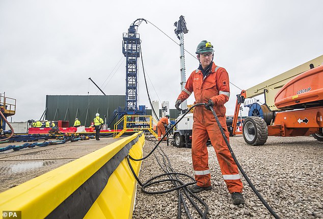 Anti-fracking campaigners argue the process, to extract shale gas, poses risks to the environment. This file photo shows a worker at the Cuadrilla fracking site in Preston New Road, Little Plumpton, Lancashire